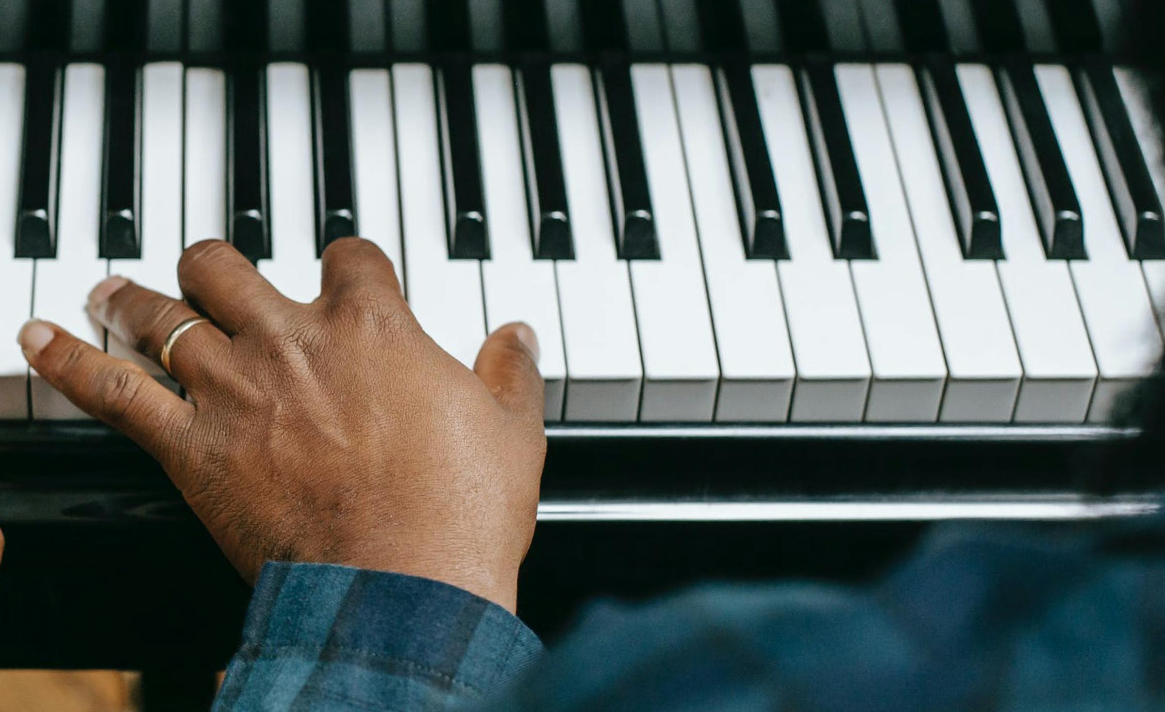 Left hand on a piano